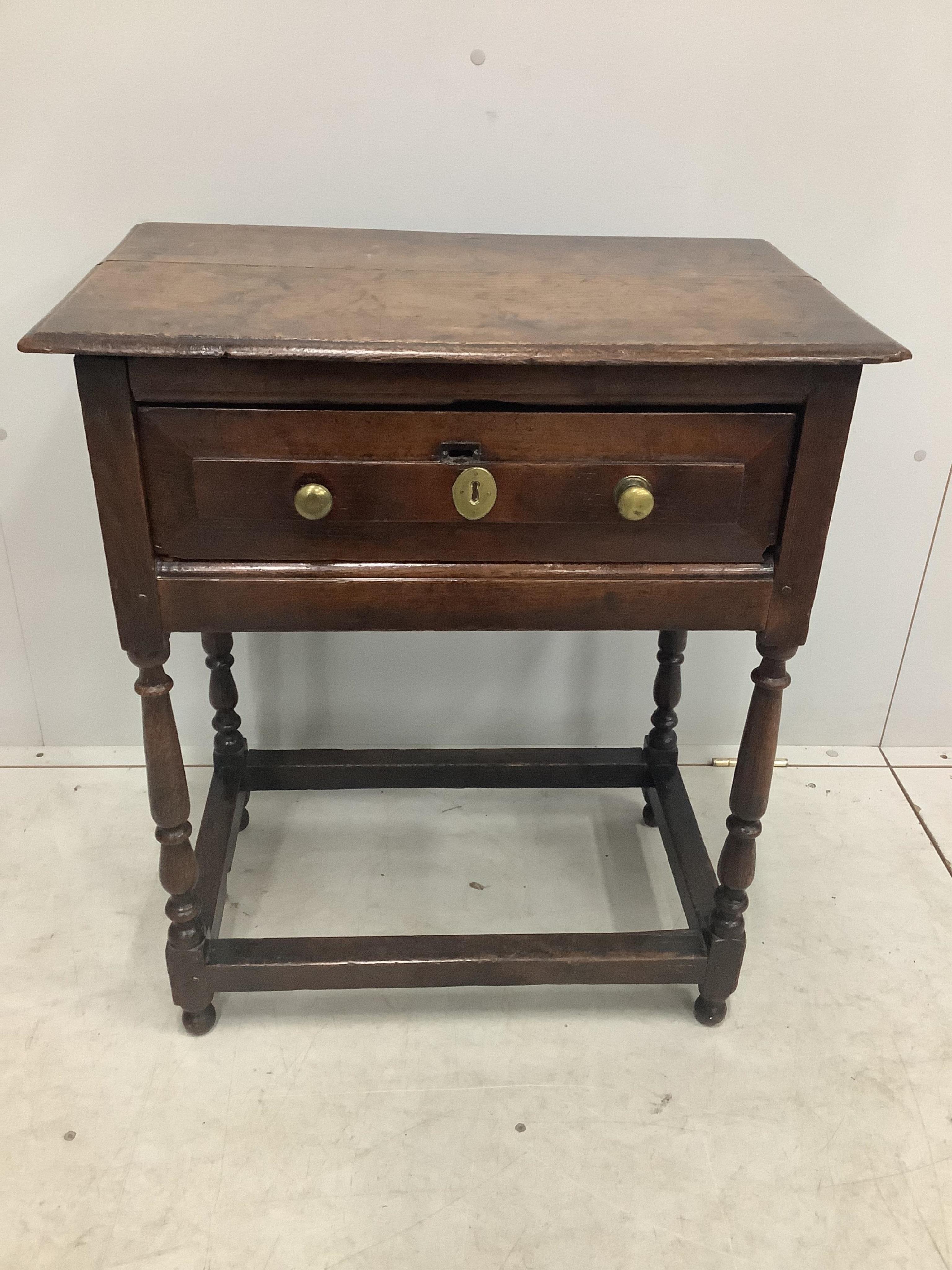 A small 18th century single drawer oak side table, width 65cm, depth 40cm, height 75cm. Condition - fair